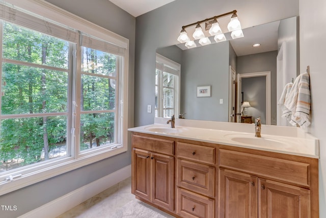 bathroom with tile patterned floors and vanity