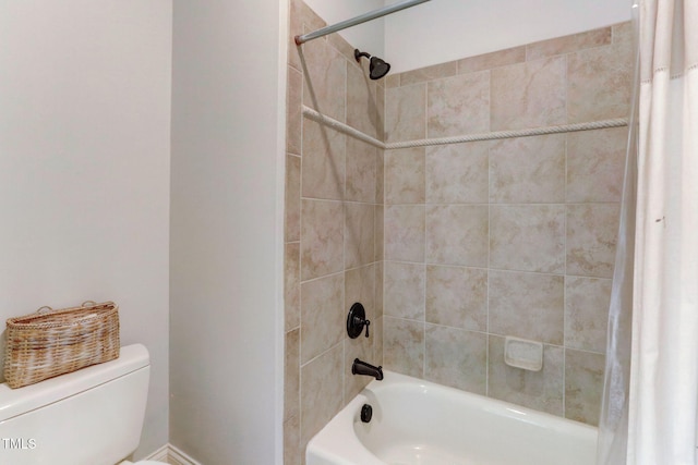 bathroom with toilet and shower / bathtub combination with curtain