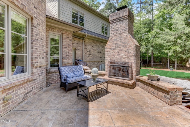 view of patio / terrace featuring an outdoor living space with a fireplace