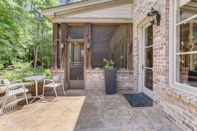 view of patio / terrace with a sunroom