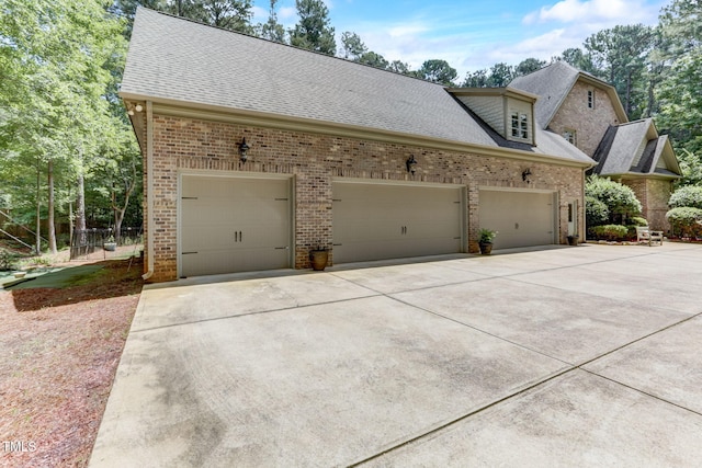 view of side of property with a garage