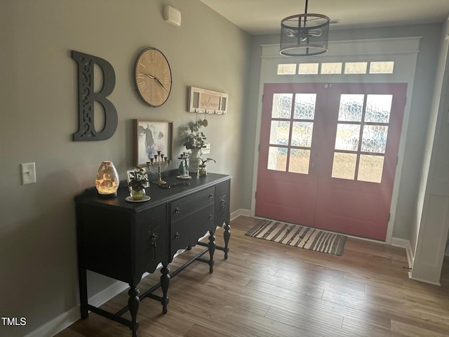 entryway with hardwood / wood-style floors