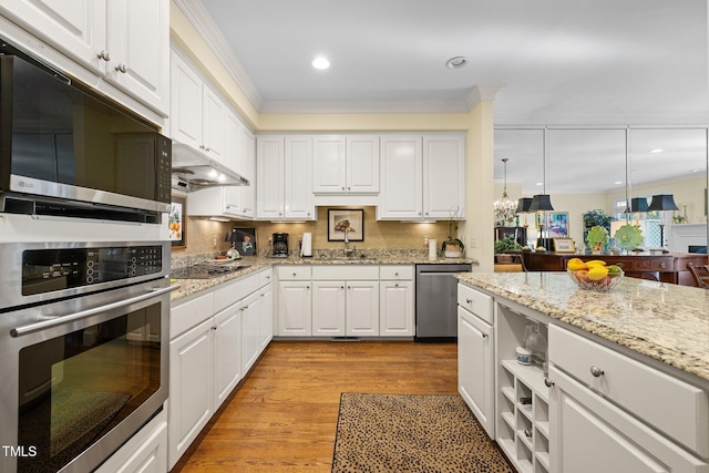 kitchen featuring white cabinetry, sink, light wood-type flooring, and appliances with stainless steel finishes