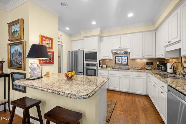 kitchen with white cabinets, appliances with stainless steel finishes, dark wood-type flooring, and sink