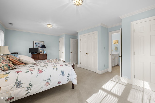 bedroom featuring crown molding, connected bathroom, and light carpet