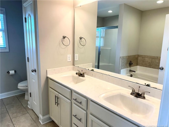 full bathroom with tile patterned floors, vanity, plus walk in shower, and toilet