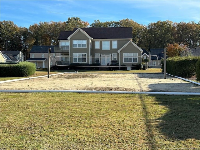 view of front of home featuring volleyball court and a front lawn