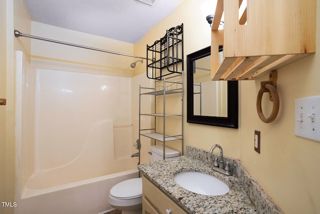 full bathroom with vanity, shower / bathing tub combination, a textured ceiling, and toilet