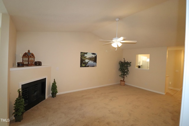 carpeted living room featuring ceiling fan and lofted ceiling