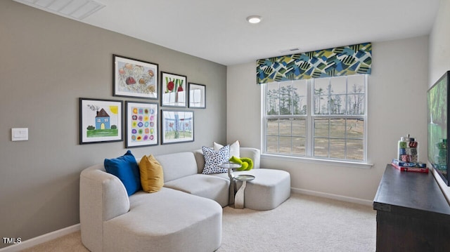 living area featuring carpet floors