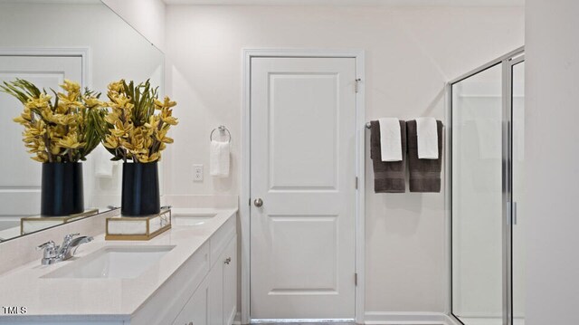 bathroom with vanity and an enclosed shower