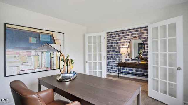 dining room with french doors and hardwood / wood-style floors