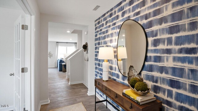 corridor featuring hardwood / wood-style floors