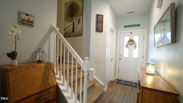 foyer entrance featuring wood-type flooring