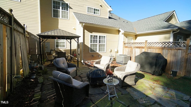 view of patio / terrace with a gazebo, grilling area, an outdoor hangout area, and central AC unit