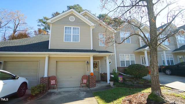 multi unit property featuring a garage