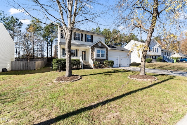 view of front of home with covered porch, a garage, and a front lawn