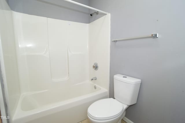 bathroom featuring bathing tub / shower combination and toilet