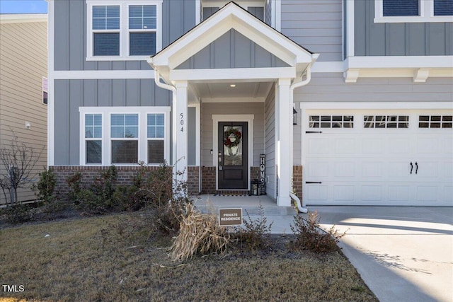 view of exterior entry with a garage