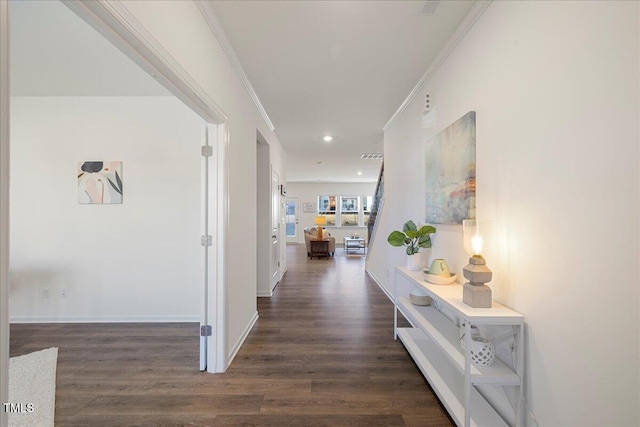 corridor with crown molding and dark wood-type flooring