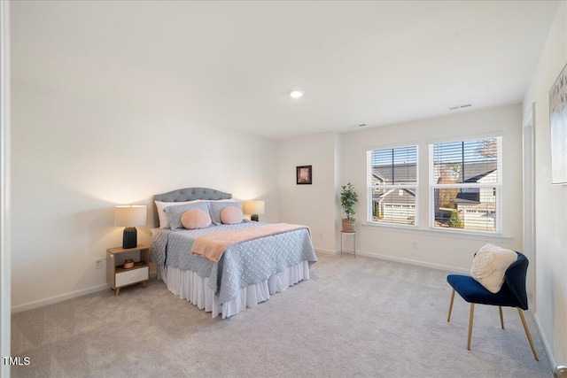 bedroom featuring light colored carpet