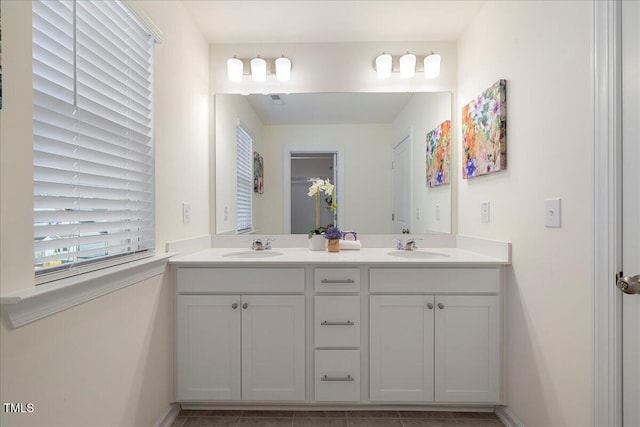 bathroom featuring tile patterned floors and vanity