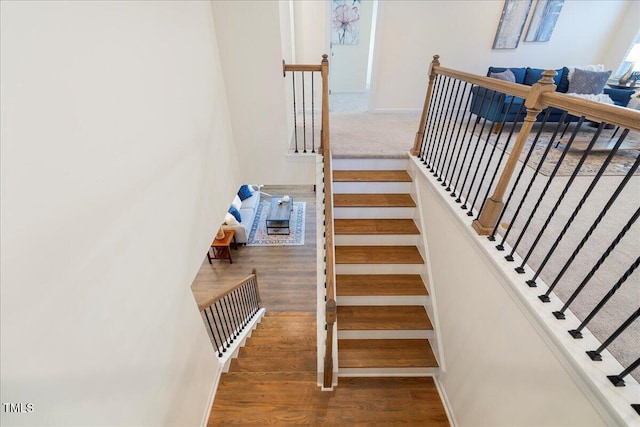 stairs with hardwood / wood-style floors