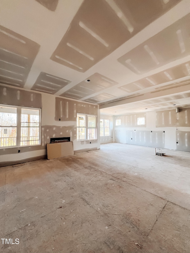 unfurnished living room featuring a healthy amount of sunlight