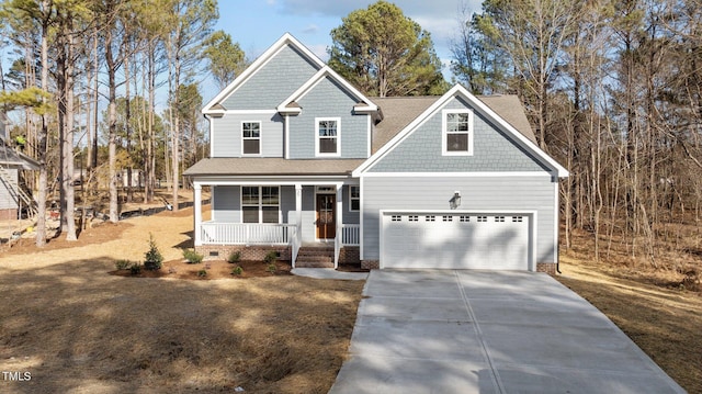 view of front of property with a garage and a porch