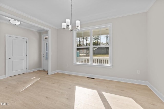 unfurnished dining area with crown molding, light hardwood / wood-style flooring, and a chandelier