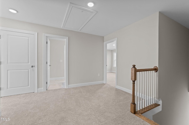 hallway with light carpet