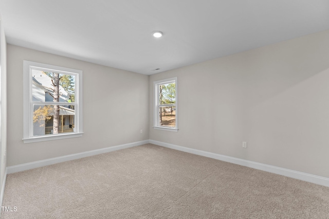 unfurnished room featuring carpet flooring