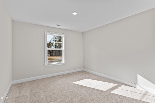 empty room featuring light colored carpet