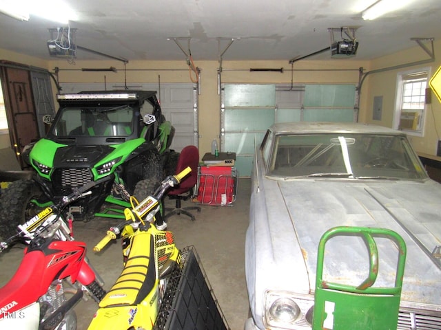 garage with electric panel and a garage door opener