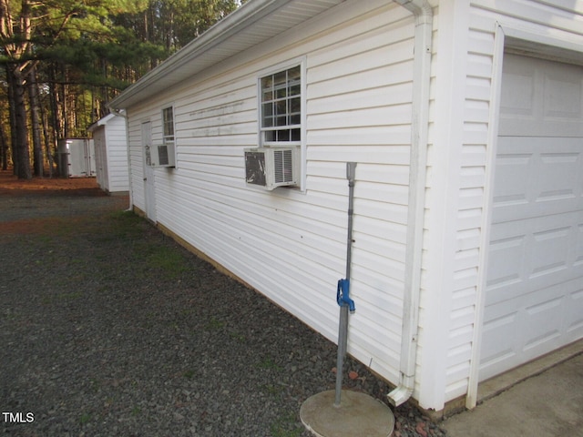 view of side of home featuring a garage