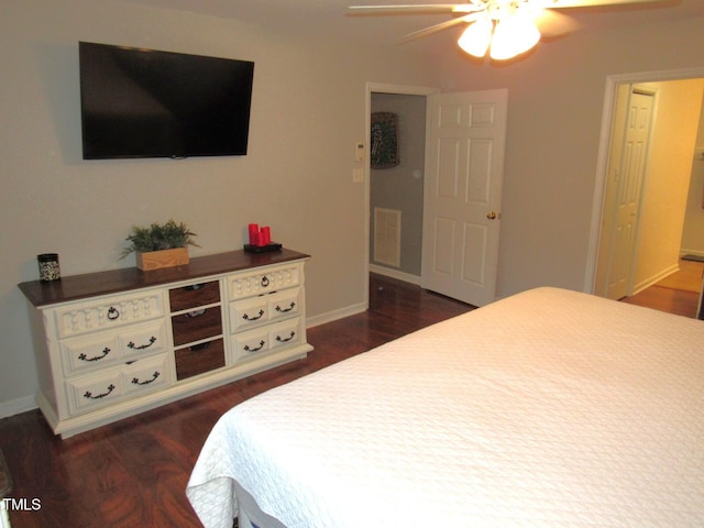 bedroom featuring ceiling fan and dark wood-type flooring