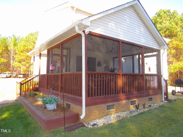 back of house with a sunroom