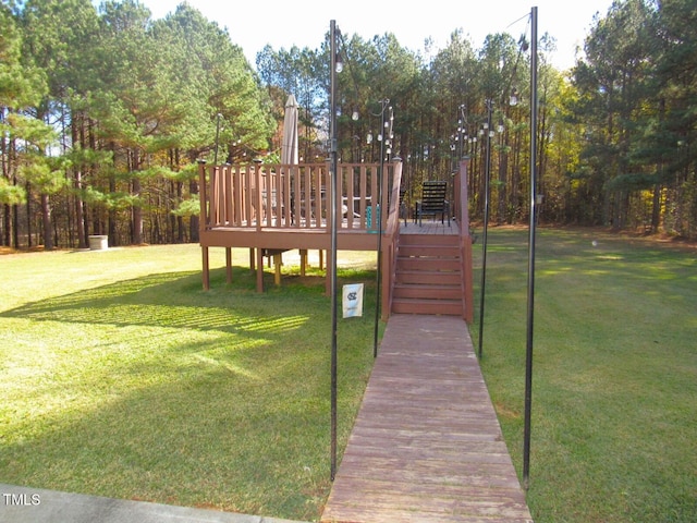 exterior space featuring a yard and a wooden deck