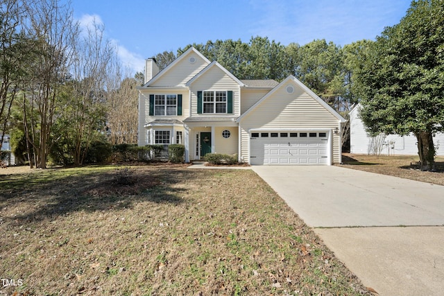 front of property featuring a garage and a front lawn