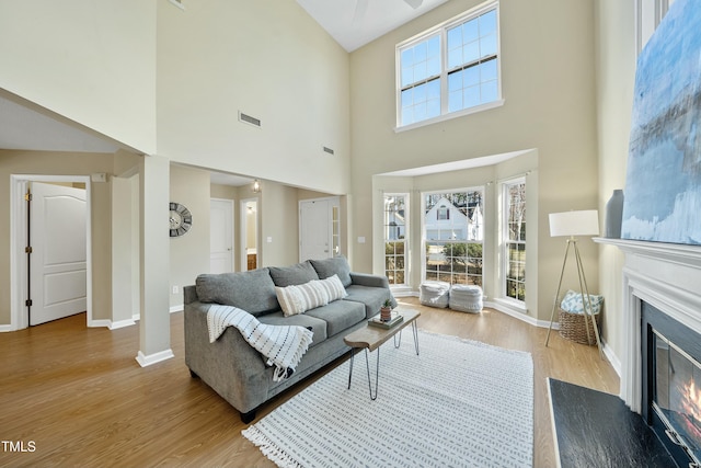 living room featuring plenty of natural light and light hardwood / wood-style floors