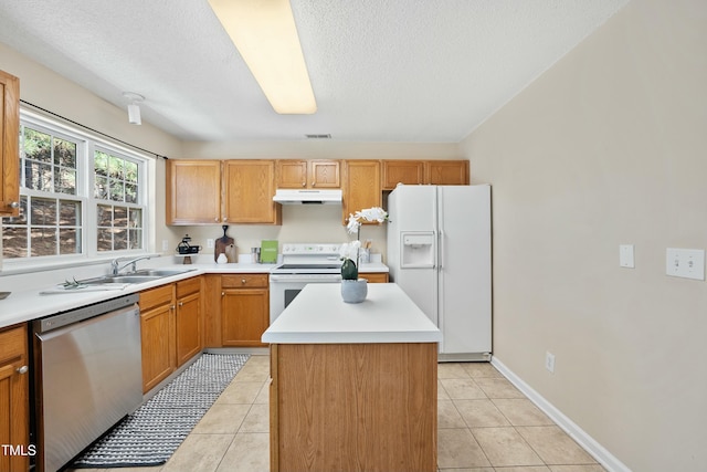 kitchen with light tile patterned flooring, a center island, sink, and white appliances