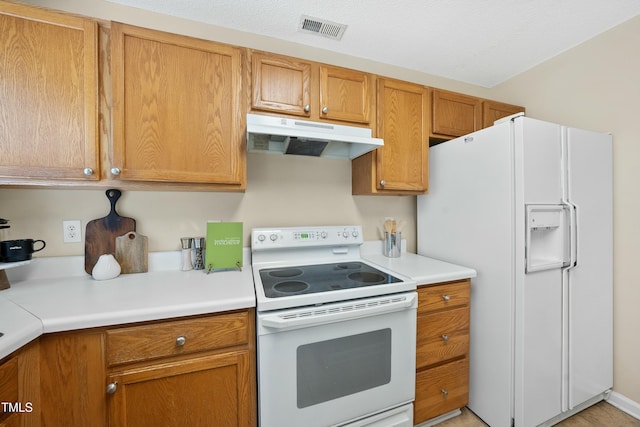 kitchen featuring white appliances