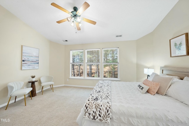 bedroom featuring ceiling fan and light carpet