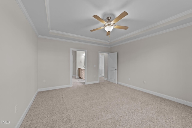 unfurnished bedroom with crown molding, light colored carpet, ceiling fan, and ensuite bathroom