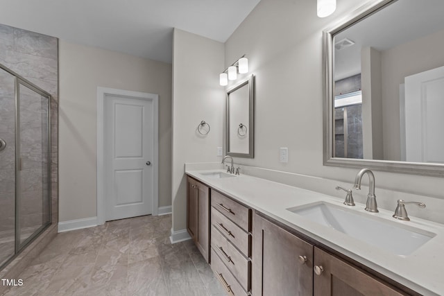 bathroom featuring vanity and a shower with shower door