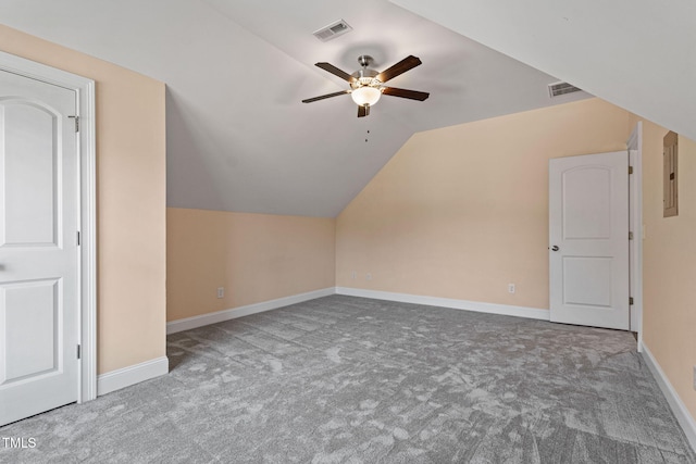 bonus room with lofted ceiling, electric panel, ceiling fan, and carpet flooring