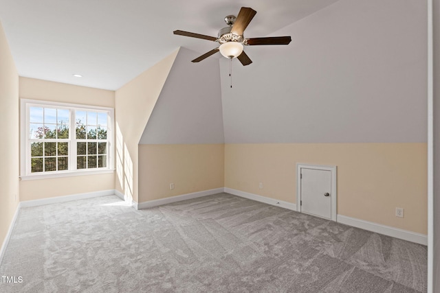 bonus room with ceiling fan, light colored carpet, and lofted ceiling