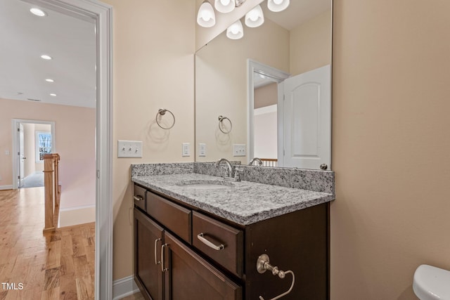 bathroom featuring vanity and hardwood / wood-style flooring