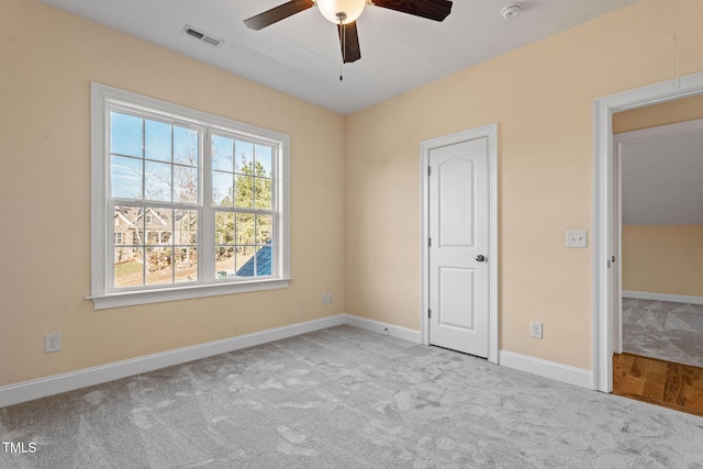 unfurnished bedroom with ceiling fan and light carpet