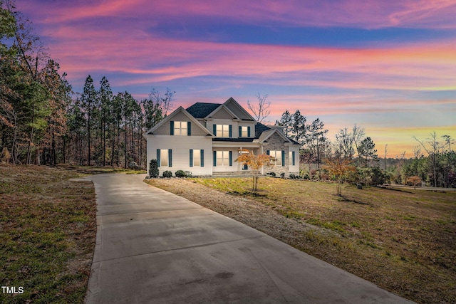 view of front of home with a lawn